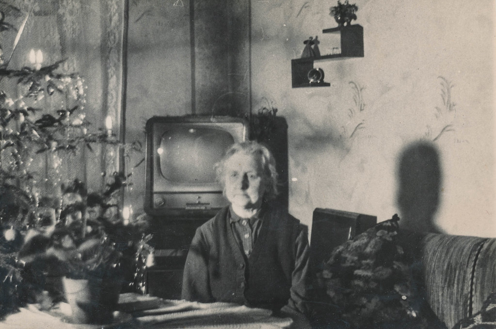 "Elderly woman sits alone for Christmas" by simpleinsomnia